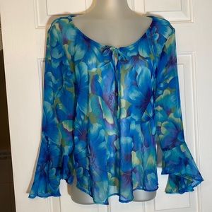 Sheer flouncy top with bell sleeves.